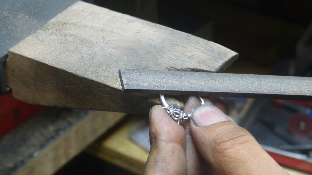 Aardvark jeweller hand-finishing a bespoke engagement ring in the studio