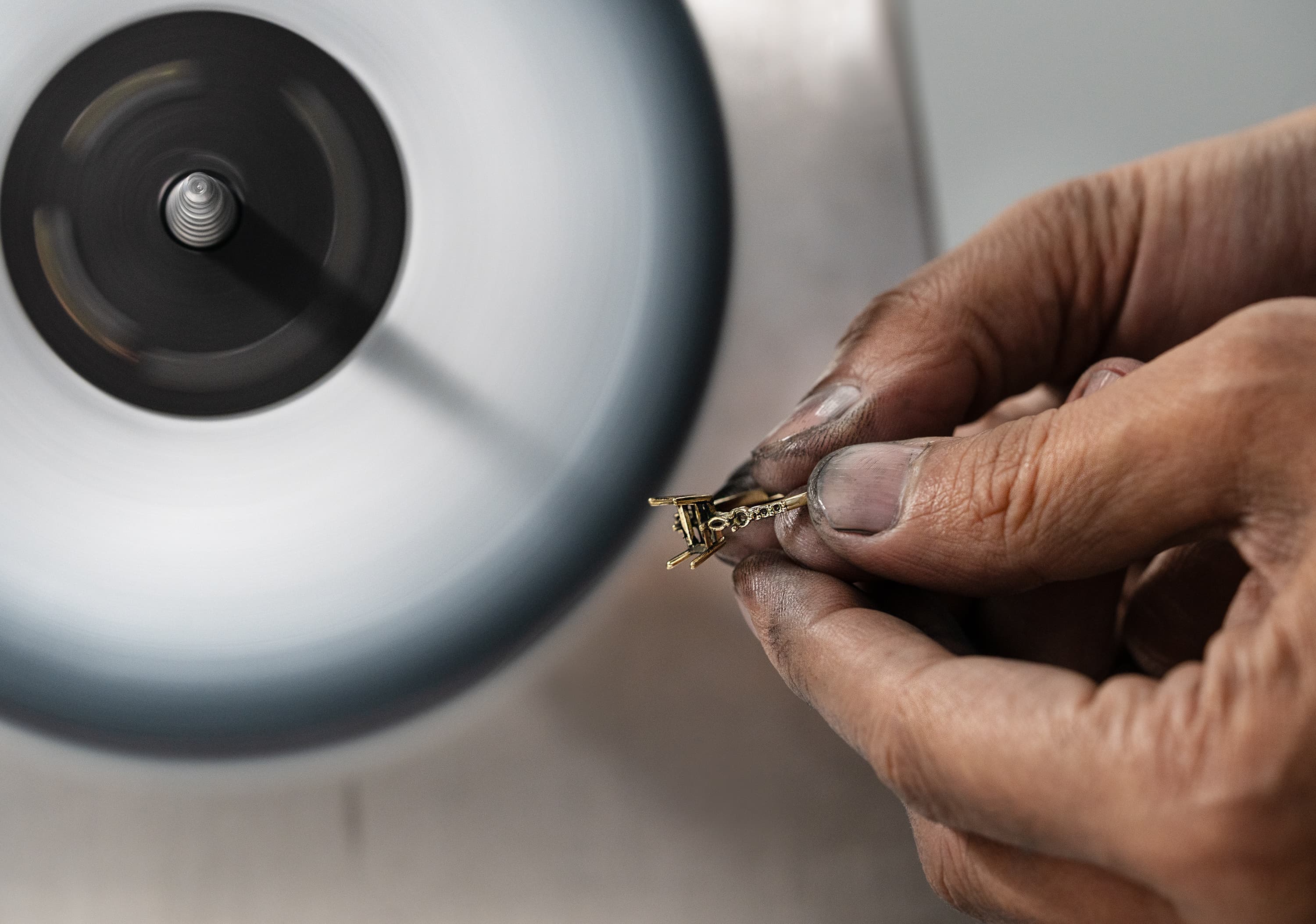 Hand-polishing a bespoke ring at the Aardvark workshop