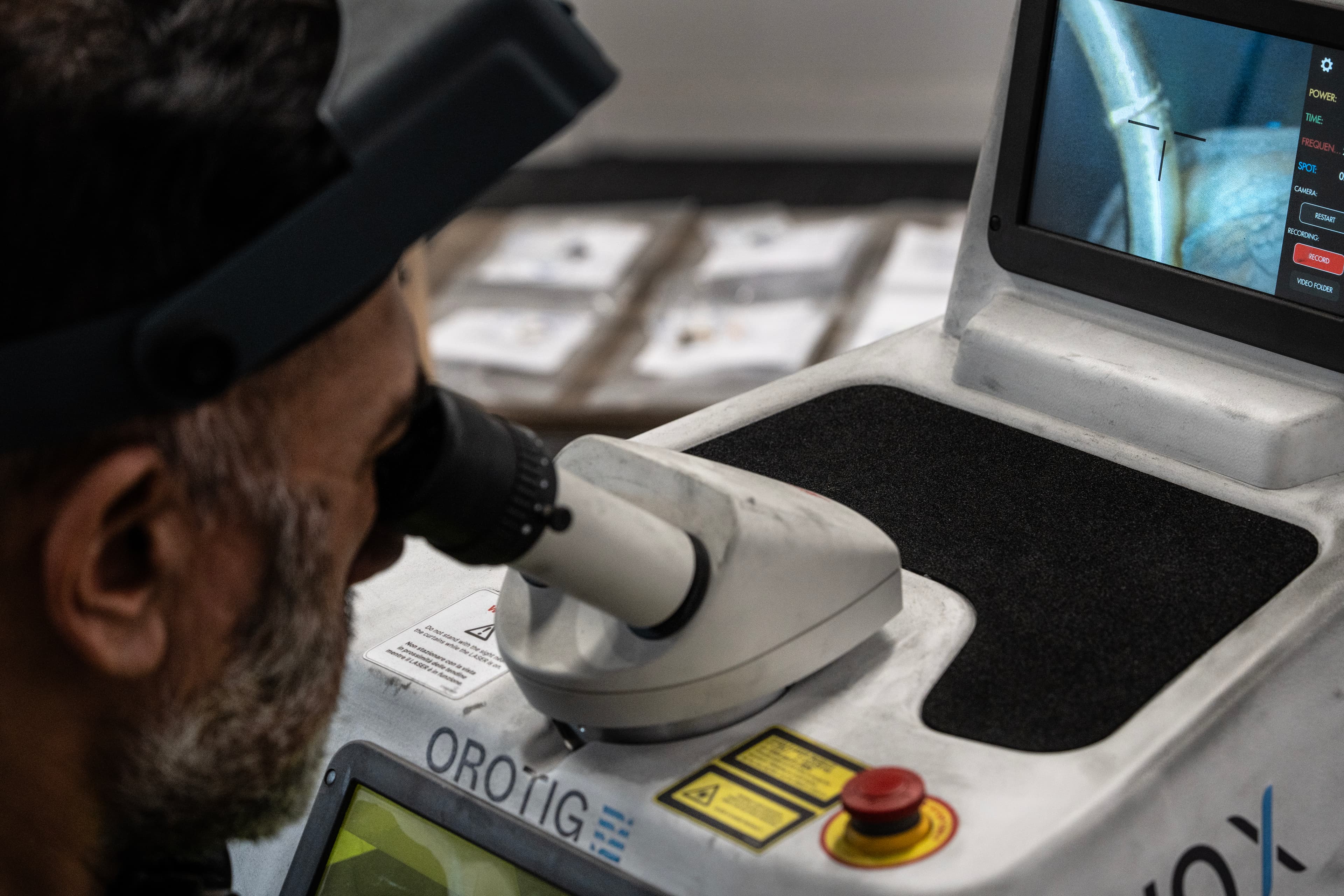 Precision stone setting under a microscope at Aardvark